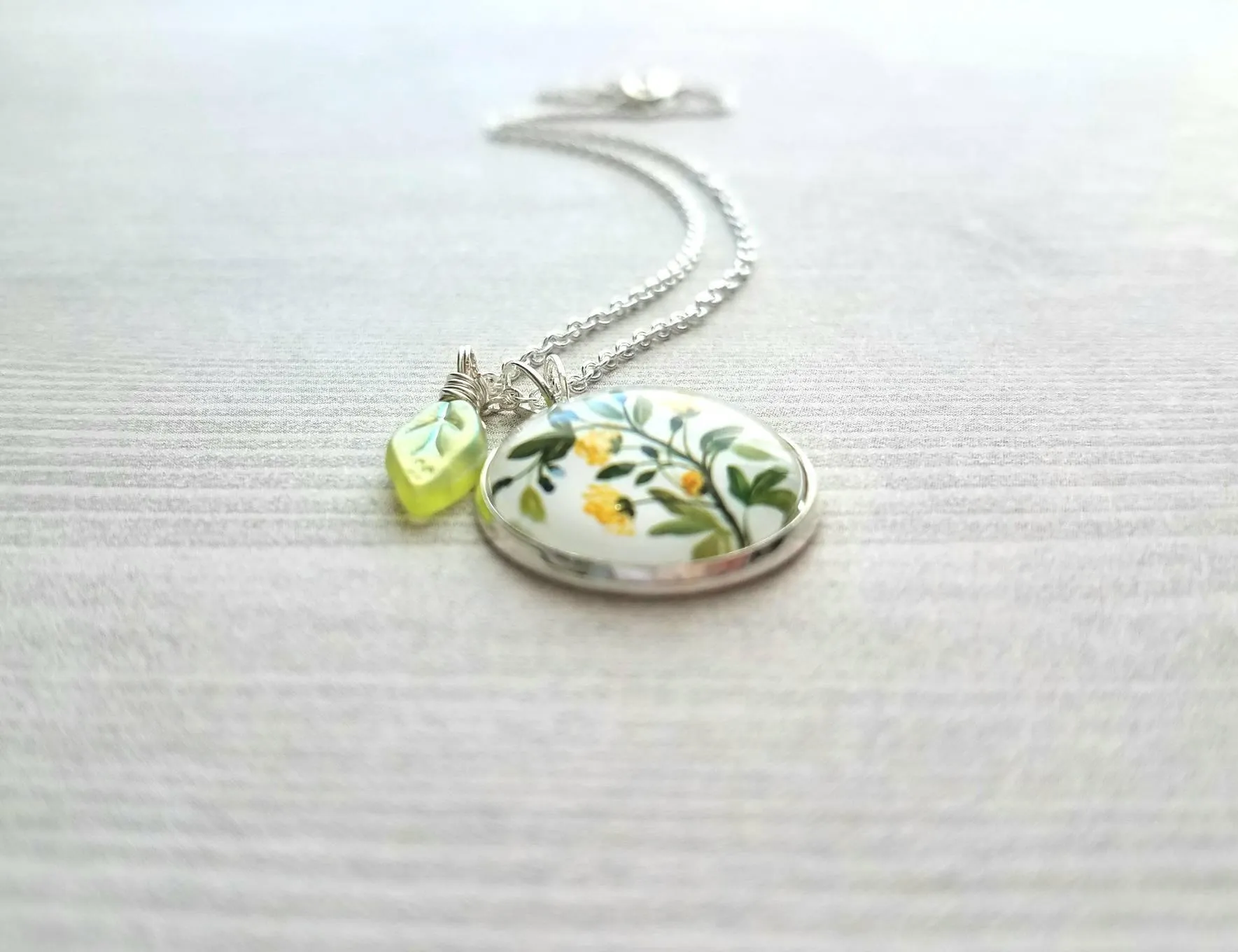 Flower Necklace, yellow flower pendant, floral necklace, plant necklace, light green leaf charm, delicate silver chain, little flowers round