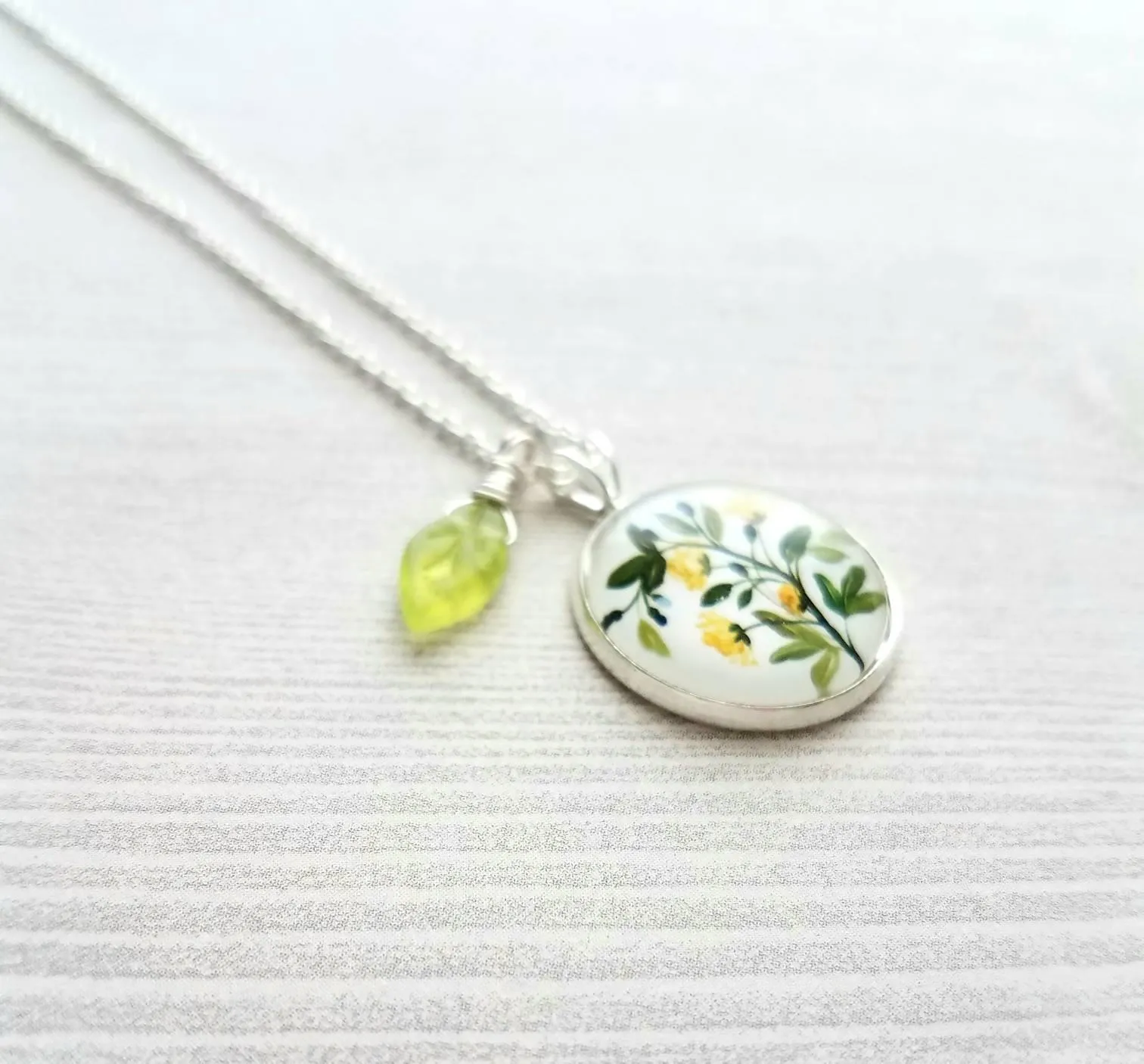Flower Necklace, yellow flower pendant, floral necklace, plant necklace, light green leaf charm, delicate silver chain, little flowers round