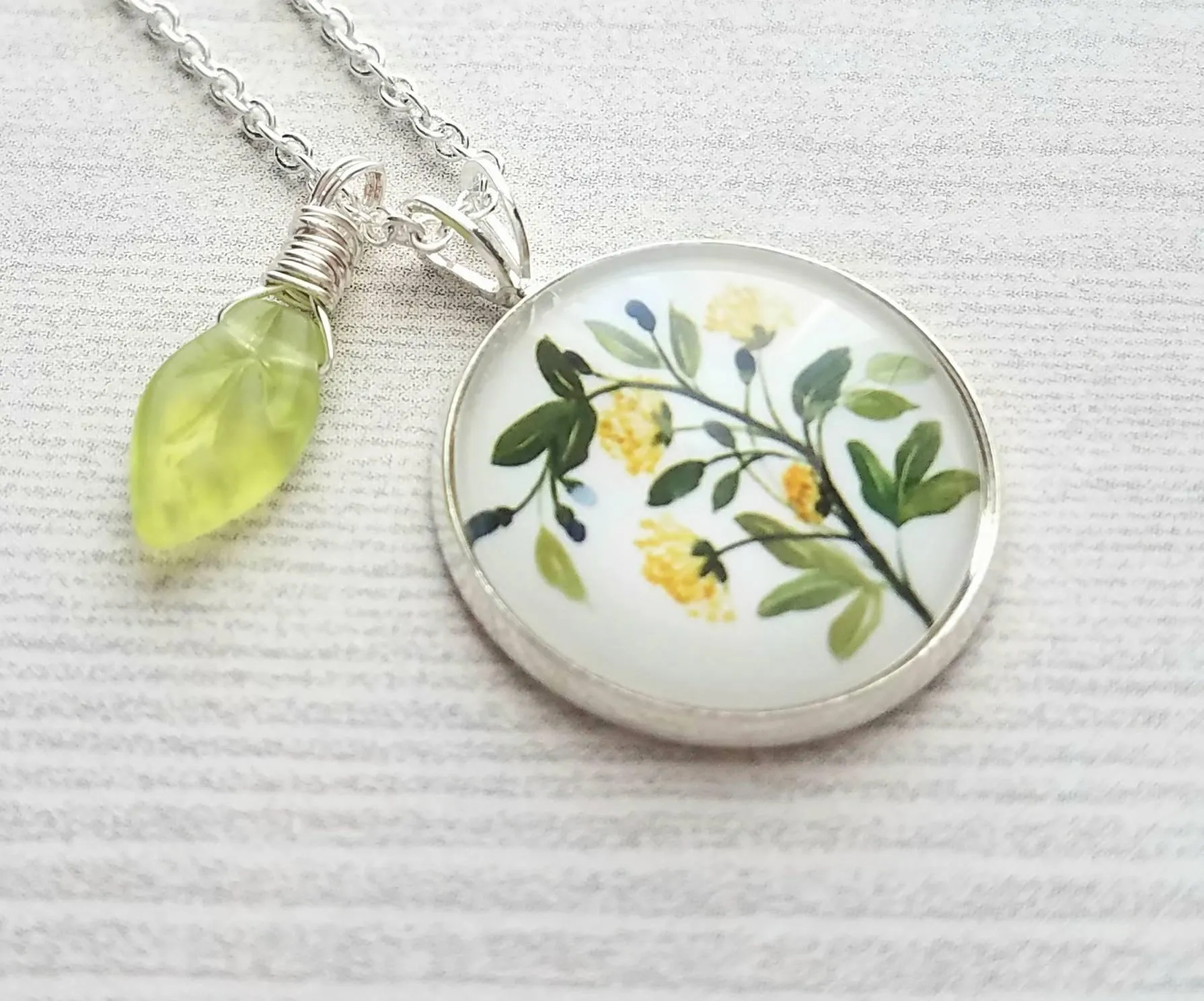 Flower Necklace, yellow flower pendant, floral necklace, plant necklace, light green leaf charm, delicate silver chain, little flowers round